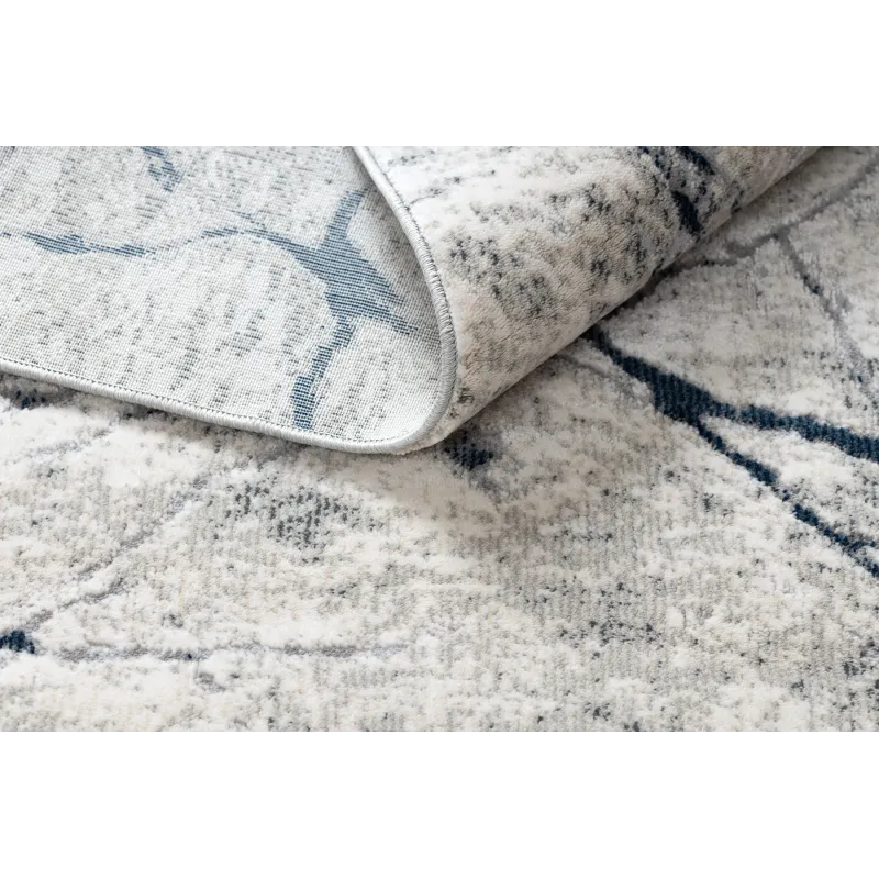 Modern REBEC rug with fringes, great for decorating a garden or terrace