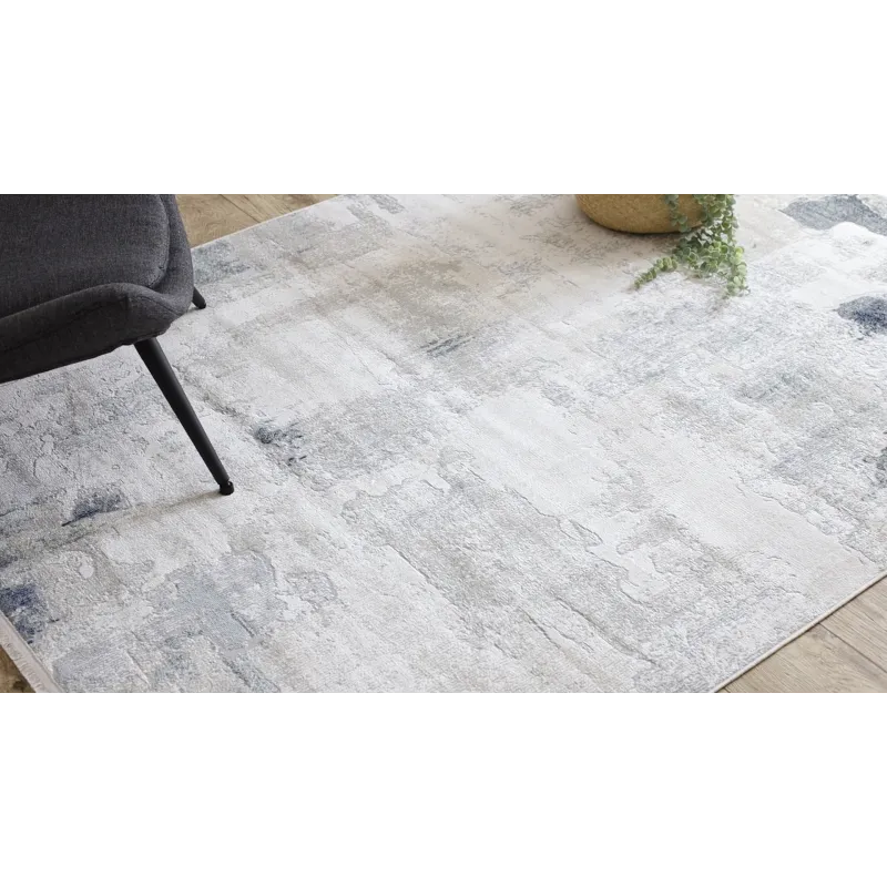 Stylish rug in shades of white, cream, and beige, perfect for modern interiors