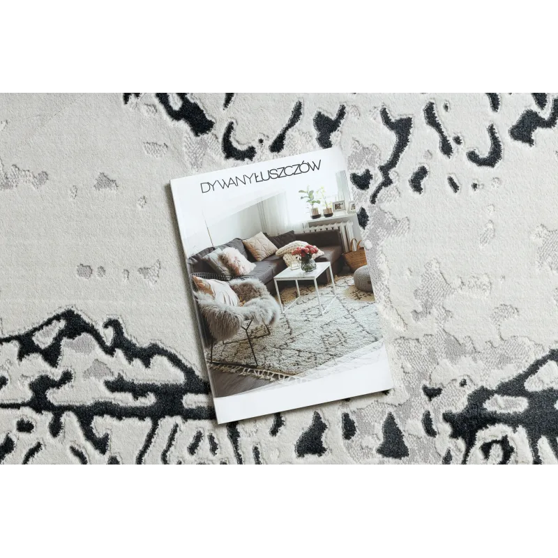 Elegant rug in white and grey tones