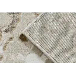 Structured rug in cream and gold, luxurious texture and style