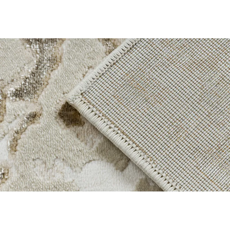 Structured rug in cream and gold, luxurious texture and style