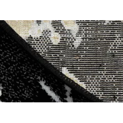 Marble textured rug in black and gold, perfect for modern interiors