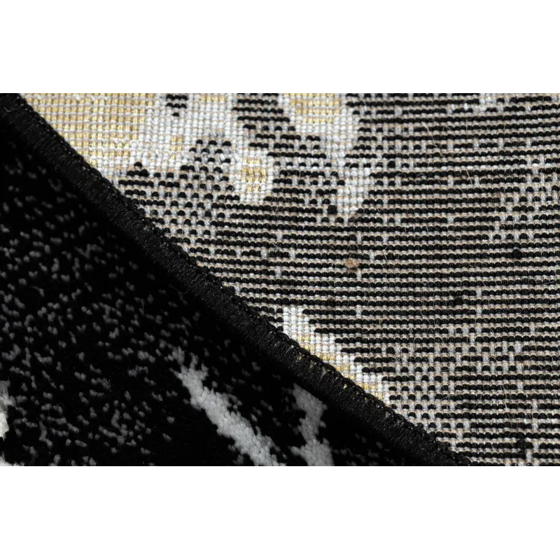 Marble textured rug in black and gold, perfect for modern interiors
