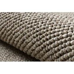 Perfect for outdoor spaces, this brown rug adds style and comfort to patios