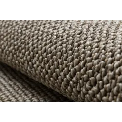 Versatile round rug for outdoor patios or gardens
