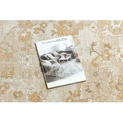 Stylish rug in beige and terracotta shades, perfect for any interior