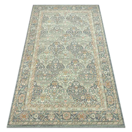 SOHO 477.27 wool rug featuring geometric diamond patterns in natural green and blue