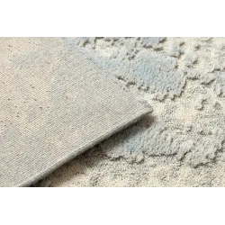 FLUX wool rug with a textured surface, perfect for contemporary living spaces