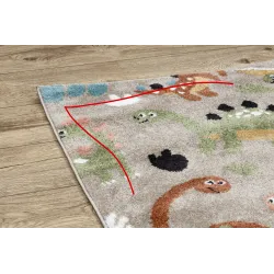 Modern beige dinosaur rug for children, perfect for a kids' room, playful design