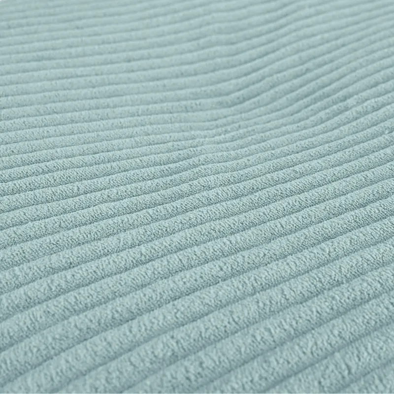 Round footstool and extra seat in soft corduroy